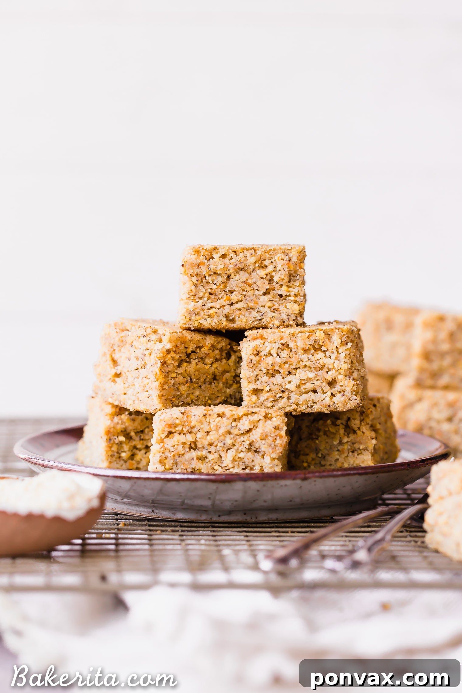This Gluten Free + Vegan Cornbread is fluffy and light with an amazing texture from the cornmeal! It's perfect served with soup or chili, served as a side or snack, or just topped with a little bit of butter or spread.