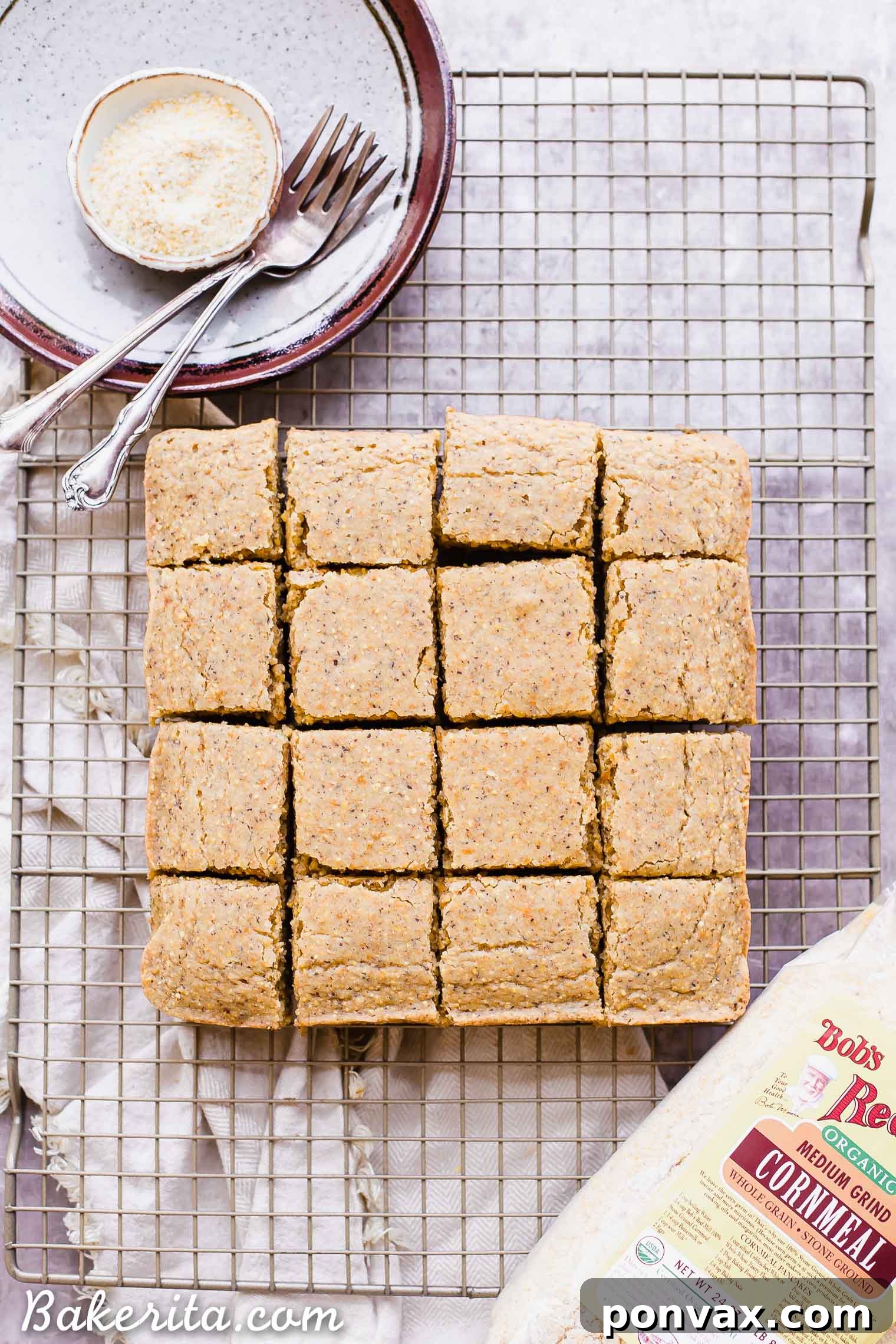 This Gluten Free + Vegan Cornbread is fluffy and light with an amazing texture from the cornmeal! It's perfect served with soup or chili, served as a side or snack, or just topped with a little bit of butter or spread.
