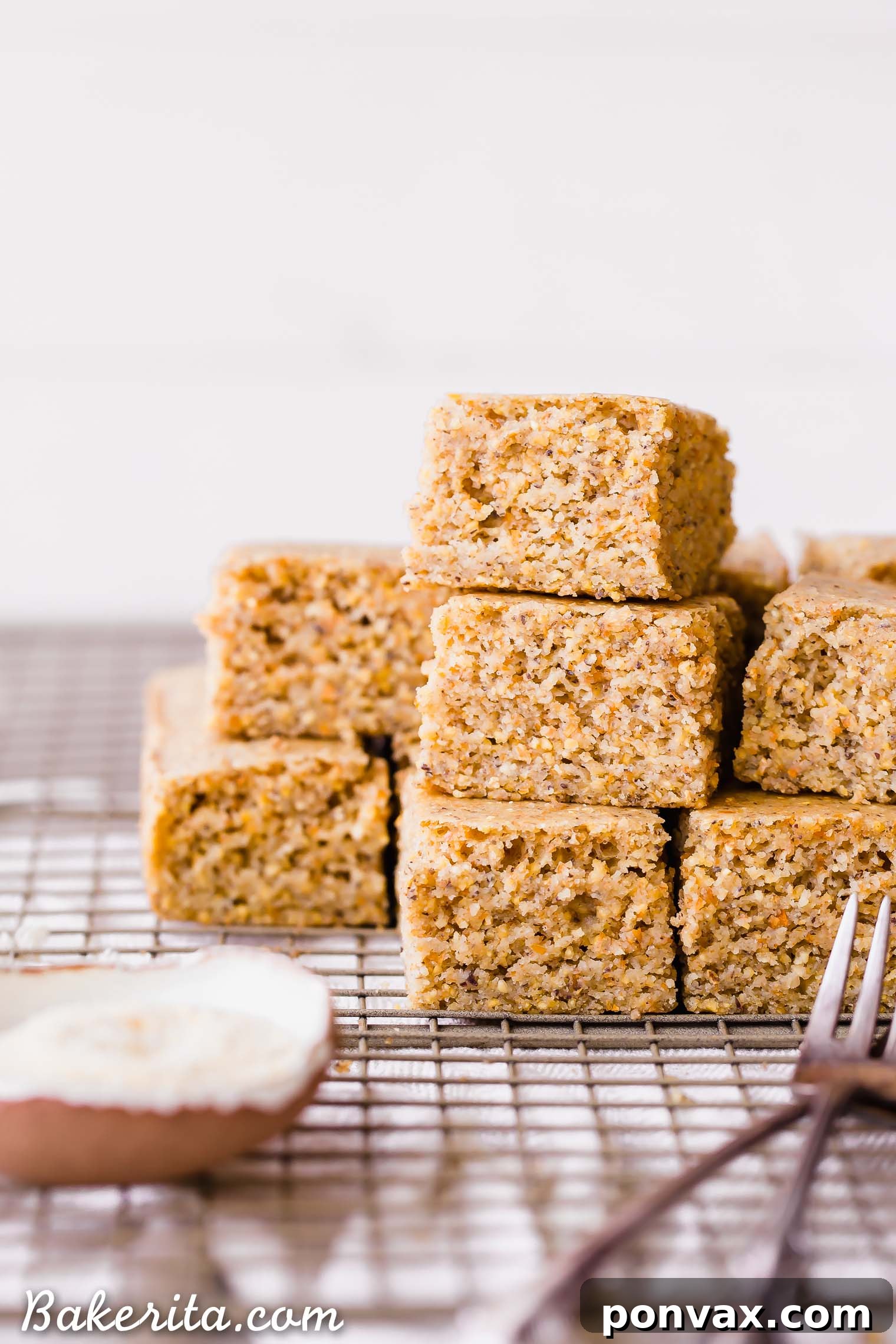 This Gluten Free + Vegan Cornbread is fluffy and light with an amazing texture from the cornmeal! It's perfect served with soup or chili, served as a side or snack, or just topped with a little bit of butter or spread.