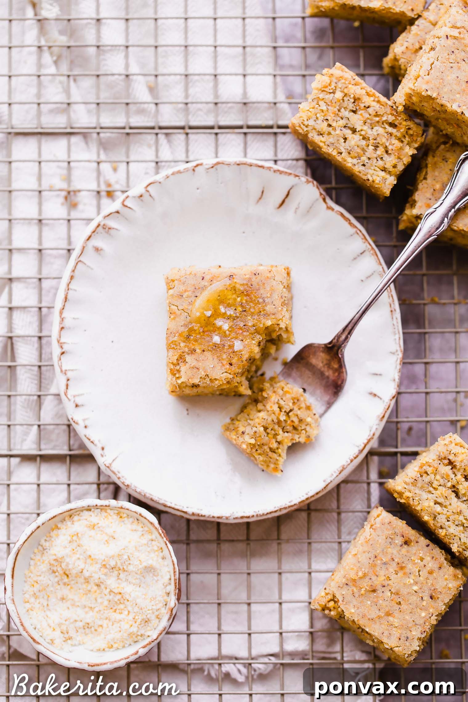 This Gluten Free + Vegan Cornbread is fluffy and light with an amazing texture from the cornmeal! It's perfect served with soup or chili, served as a side or snack, or just topped with a little bit of butter or spread.