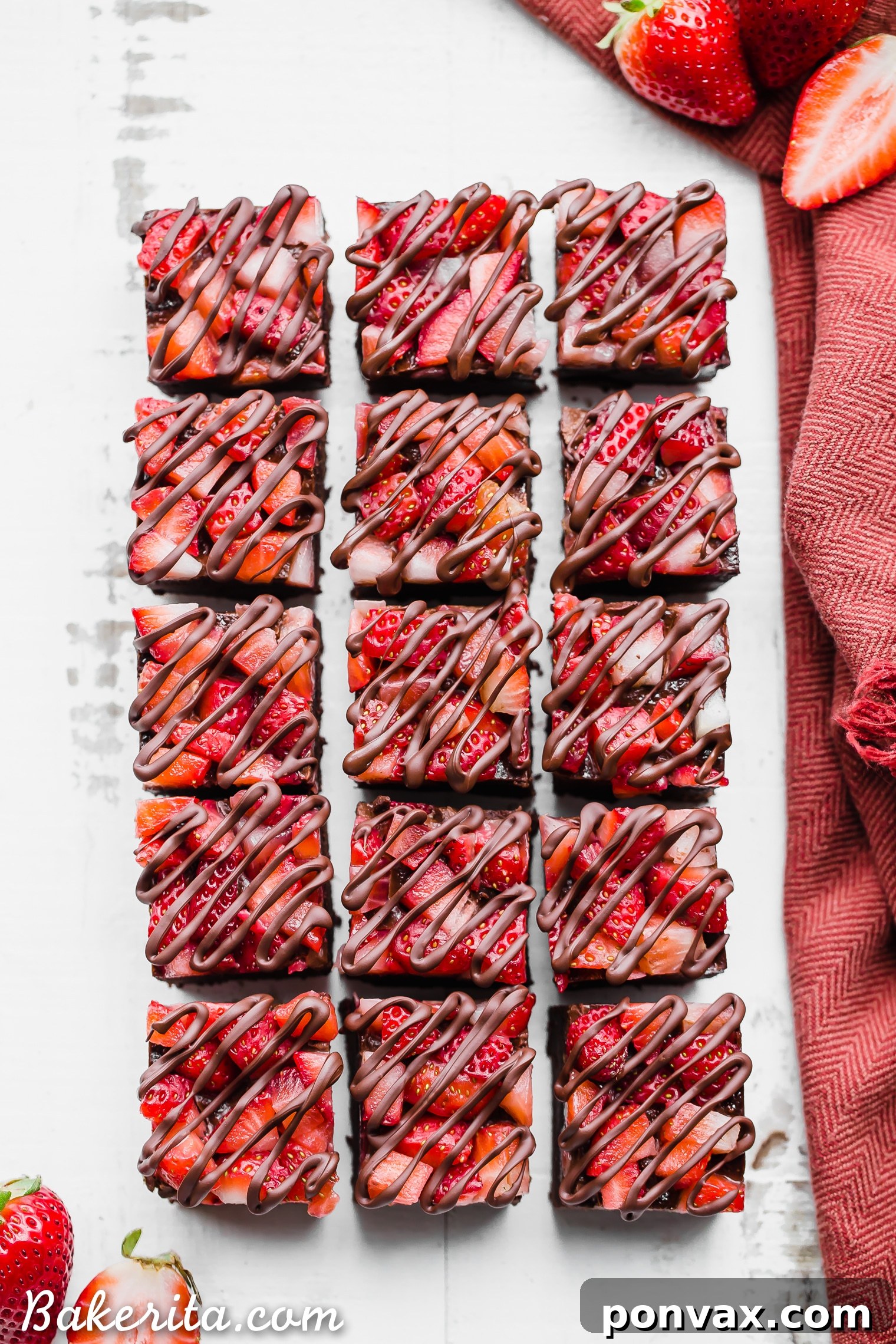Almond butter being stirred in a bowl, a key ingredient for the creamy texture of the Chocolate Strawberry Fudge.