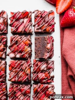 This Chocolate Strawberry Fudge is a simple and delicious five-ingredient recipe you'll want to make over and over! This fudge tastes just like chocolate covered strawberries. There's no cooking required for this gluten-free, paleo and vegan fudge recipe. 