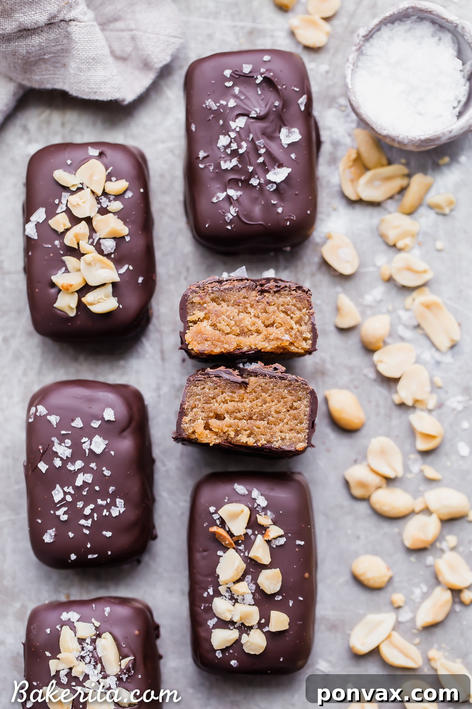 Gluten-free, grain-free, and vegan-friendly Dark Chocolate Peanut Butter Truffle Bars, topped with sea salt and chopped peanuts.