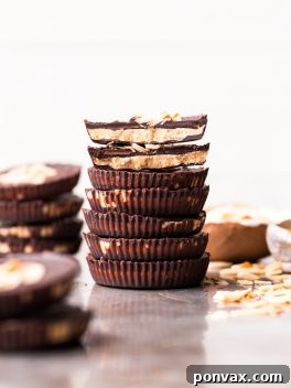 These Toasted Coconut Butter Cups are made with just four simple ingredients! Toasted coconut butter is the star of the show, encased in decadent homemade chocolate for a healthy homemade candy that will satisfy your sweet tooth. You're going to love these paleo + vegan coconut butter cups.