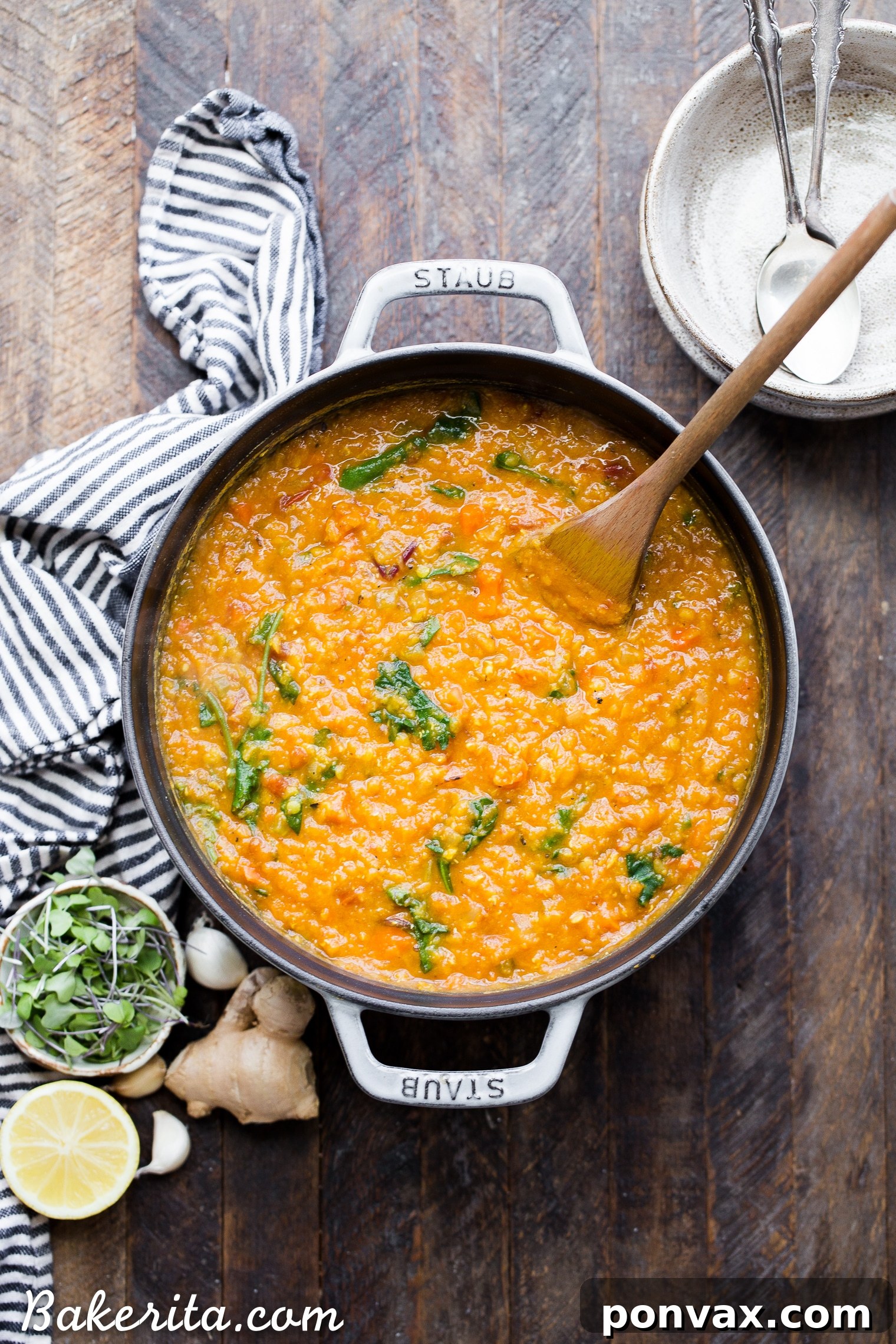 Creamy Vegan Red Lentil Delight 3 Close-up of a pot of Vegan Red Lentil Soup simmering, showcasing its rich, golden-orange color and thick consistency, ready to be enjoyed.