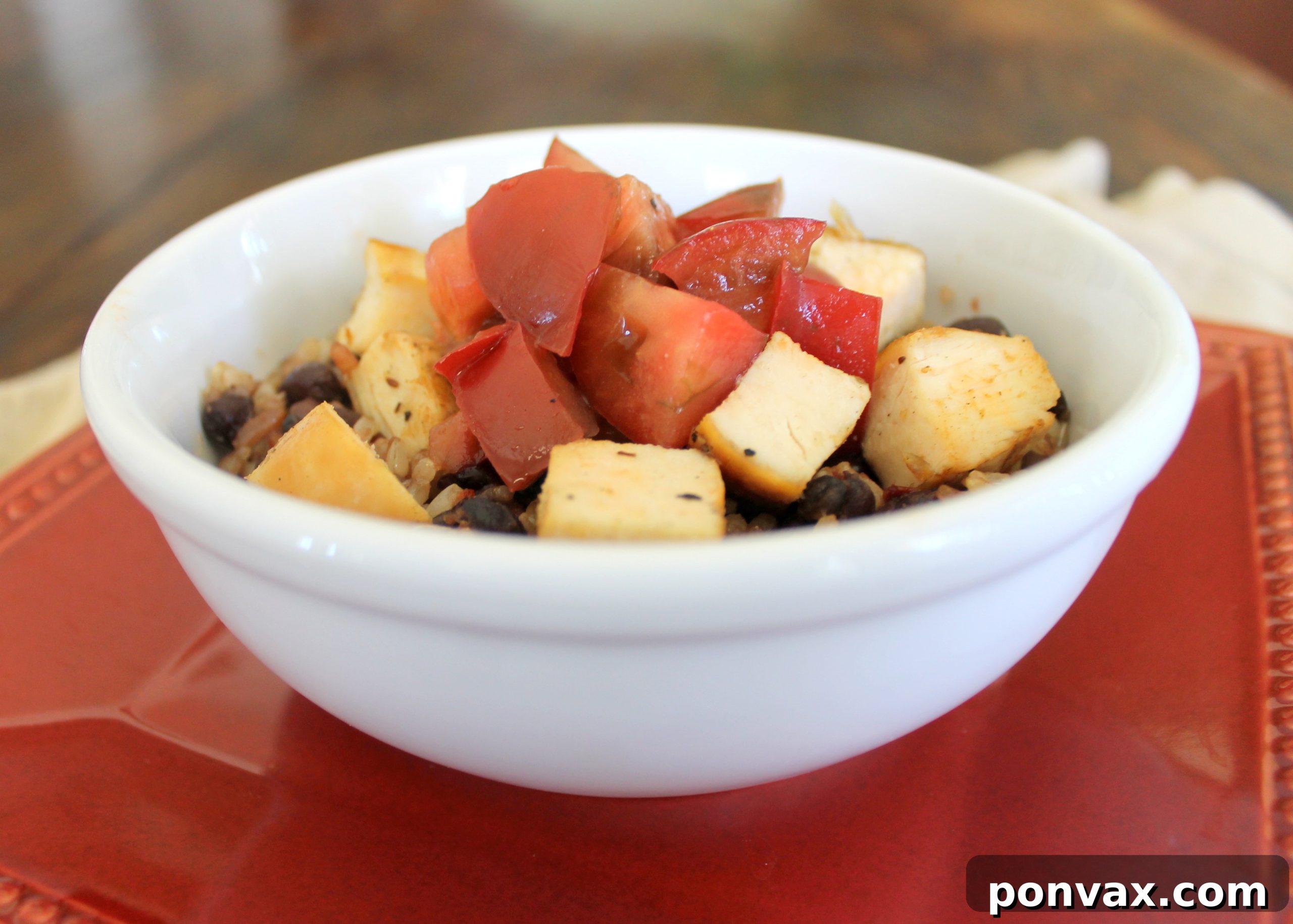 Nutritious Warm Brown Rice & Black Bean Chicken Salad Healthy chicken and black bean salad with brown rice and heirloom tomatoes