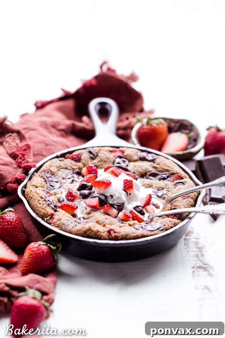 Decadent Gluten-Free Strawberry Chocolate Skillet Cookie 4 This Strawberry Chocolate Chunk Skillet Cookie is gooey in the middle, with crispy edges and all the flavors you love in a chocolate covered strawberry! This gluten-free, paleo and vegan skillet cookie will satisfy all your cravings - the fresh strawberries are the perfect fruity addition to this rich, chocolatey treat!