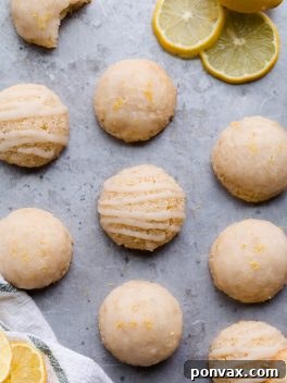These Lemon Macaroons are bright with lemon flavor, with a touch of maple sweetness and a deliciously chewy texture. The tart lemon glaze is made with coconut butter. You're going to love these irresistibly scrumptious gluten-free, paleo, and vegan macaroons.