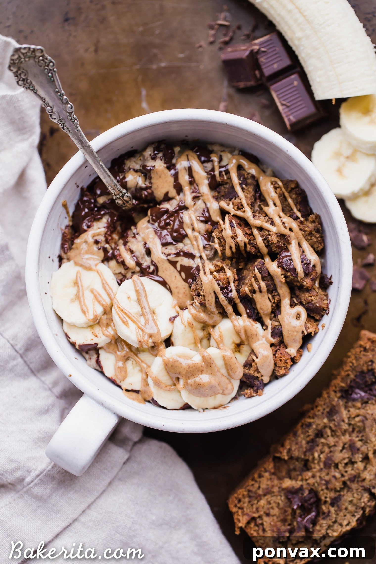 Overhead view of Banana Bread Oatmeal with various toppings like chocolate chips and fresh banana.