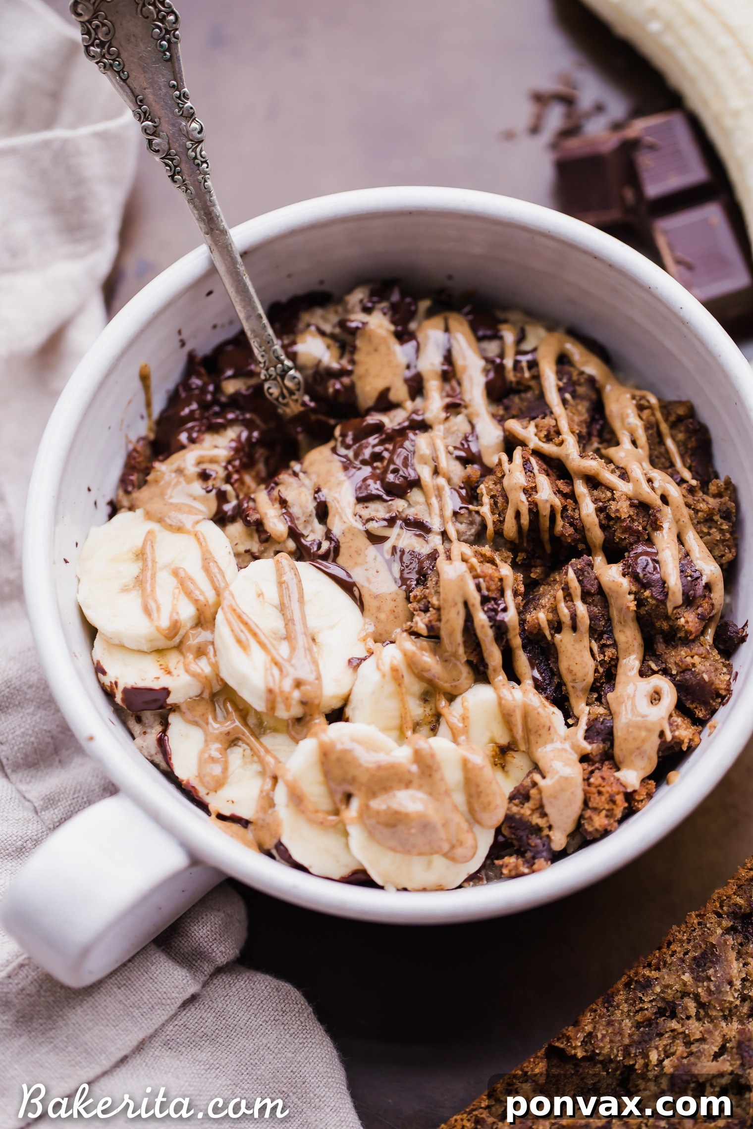 A spoon scooping a portion of Banana Bread Oatmeal, highlighting its rich, comforting consistency.
