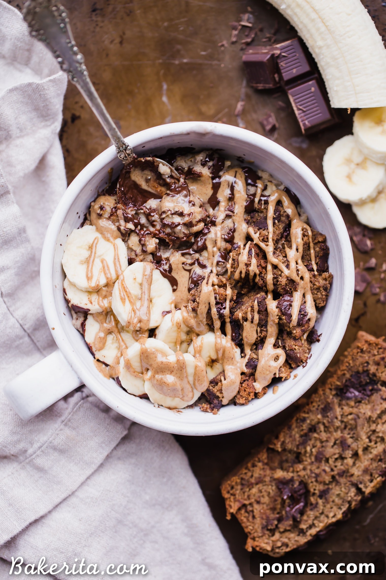 A beautifully plated bowl of Banana Bread Oatmeal, garnished with ripe banana slices and a drizzle of nut butter.