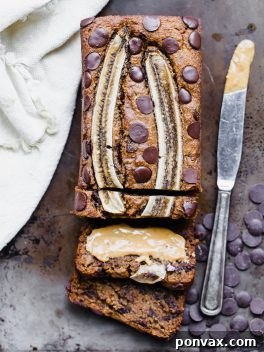 Plant Based Gluten Free Chocolate Chip Banana Bread 2 Delicious Chocolate Chip Vegan Banana Bread slices on a cooling rack