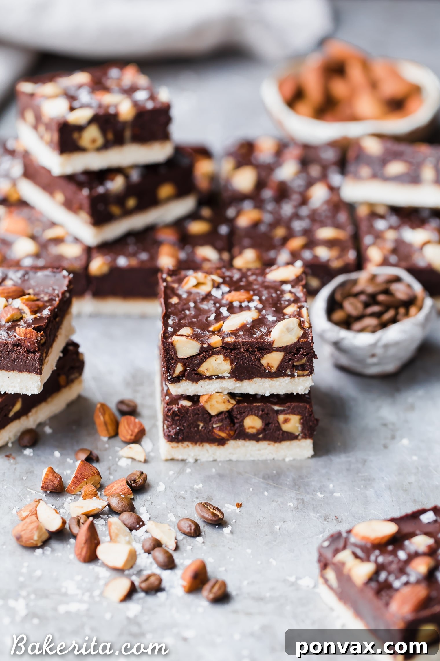 Rich Mocha Almond Fudge Bars with a chocolate-coffee fudge and crunchy almonds on a shortbread crust. These gluten-free, paleo, and vegan fudge bars are truly irresistible!