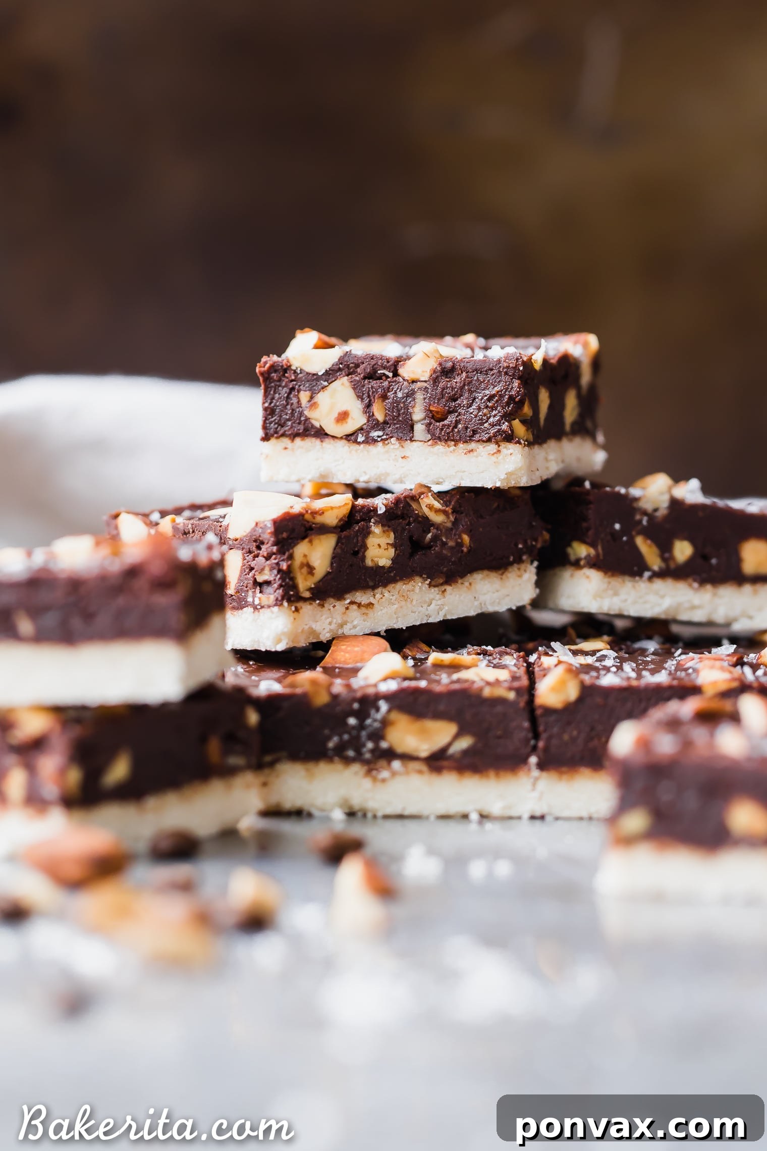 A hand reaching for a Mocha Almond Fudge Bar, emphasizing its deliciousness and the ease of grabbing a healthy, satisfying treat.