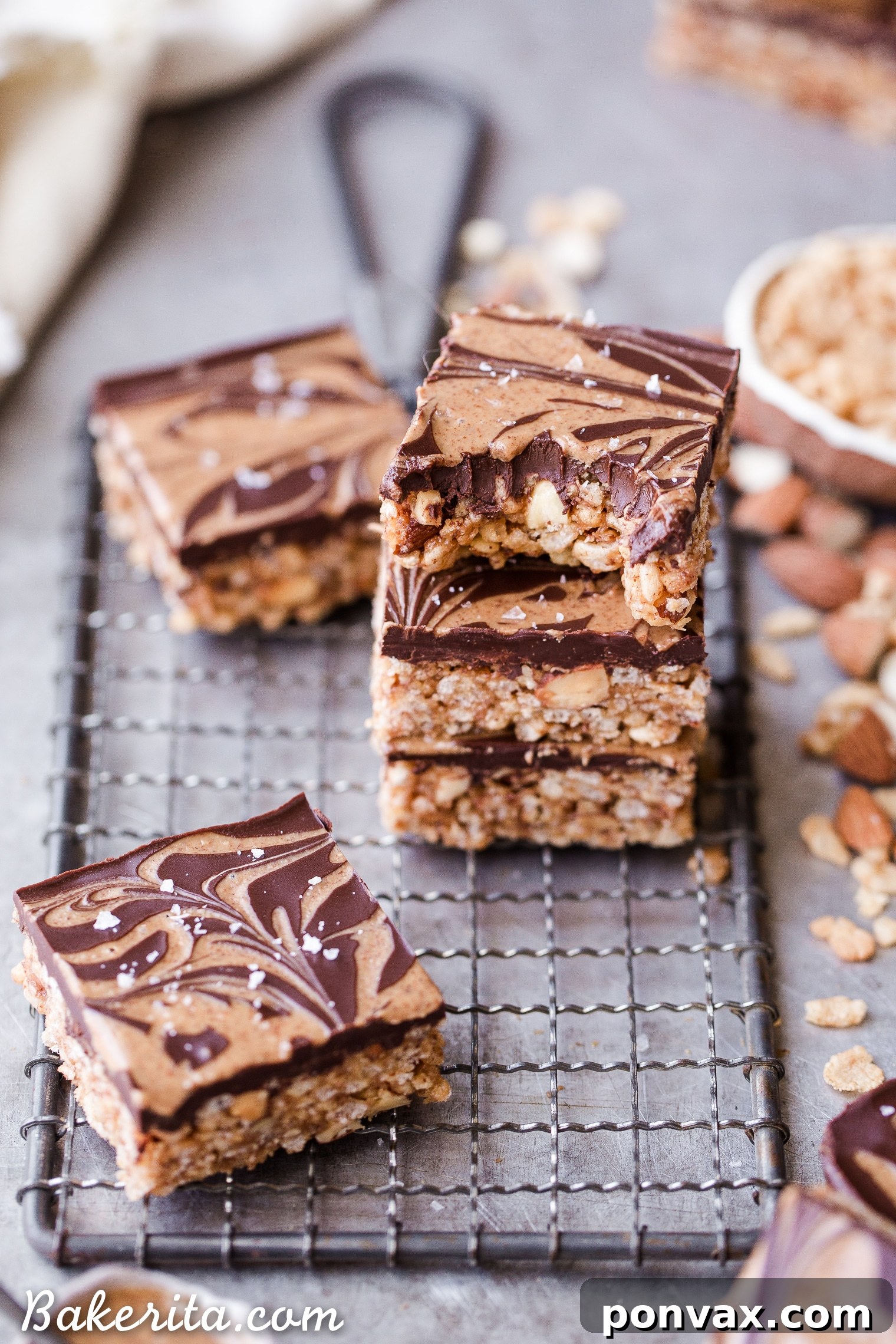 Guilt Free Crispy Chocolate Almond Butter Bars 4 Mixing the crispy base ingredients: puffed brown rice cereal and chopped almonds in a bowl.