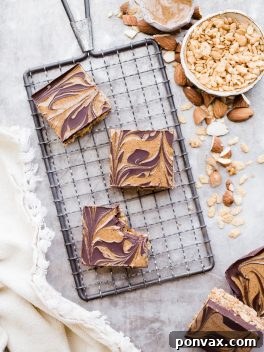 Guilt Free Crispy Chocolate Almond Butter Bars 7 Top view of a freshly made batch of Chocolate Almond Butter Crispy Bars, ready to be cut.