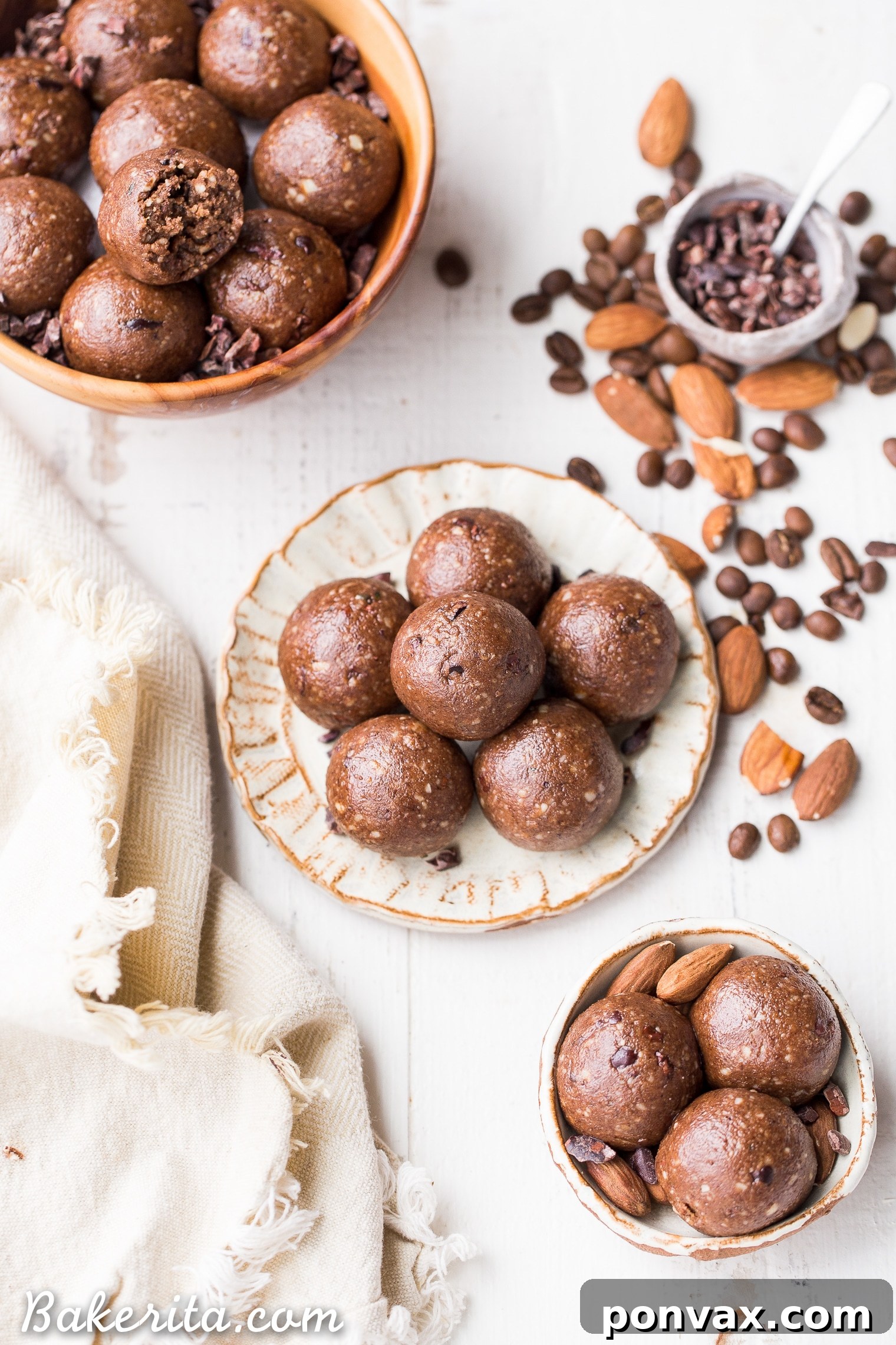 Keto Vegan Paleo Gluten Free Mocha Almond Fat Balls 5 A hand reaching for a Mocha Almond Fat Ball, illustrating its grab-and-go convenience and appeal as a nourishing snack. Gluten-free, paleo, vegan, Whole30, and keto-compliant.