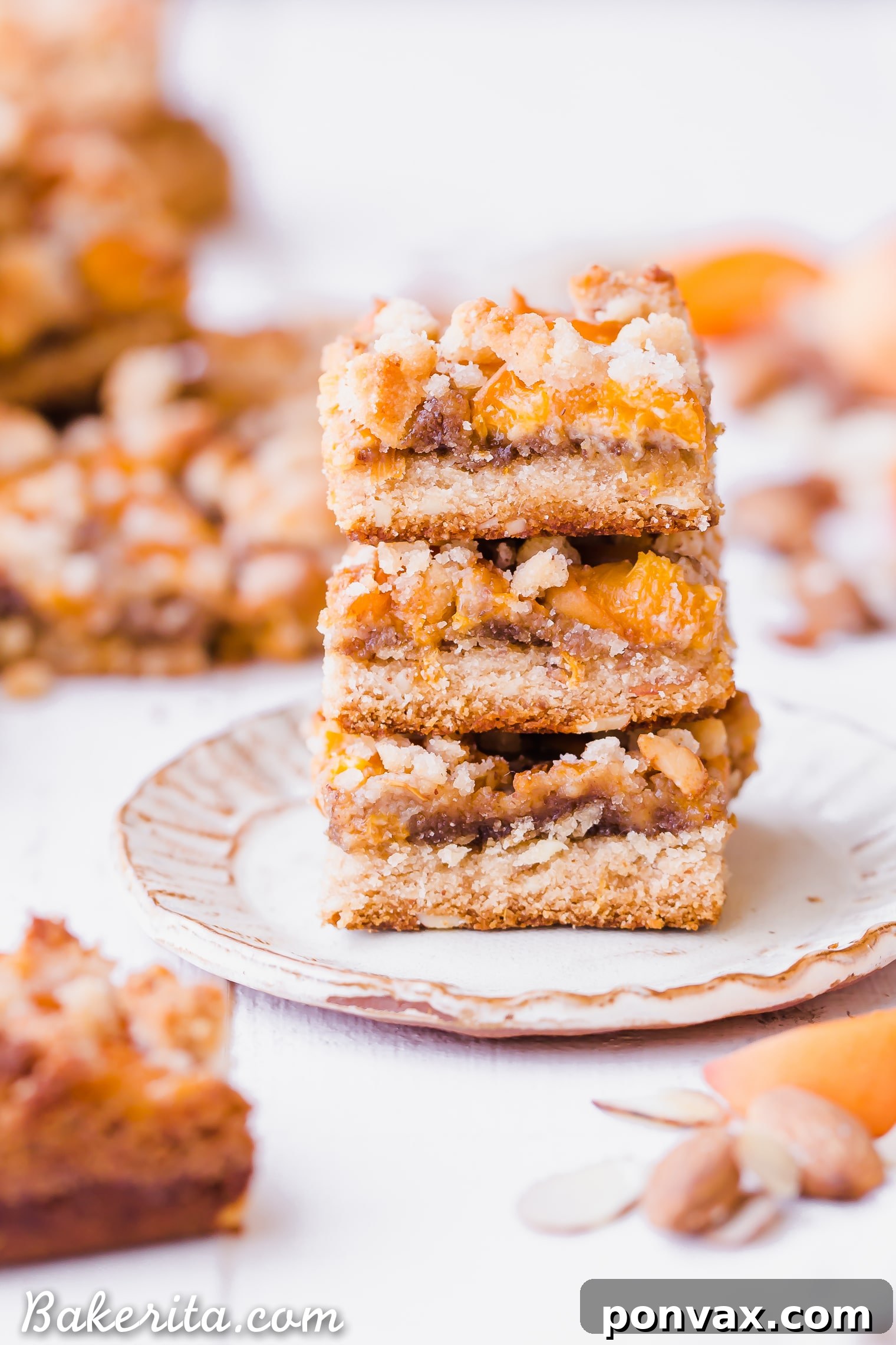 Stacked Apricot Frangipane Bars showcasing the shortbread crust and almond frangipane layer.