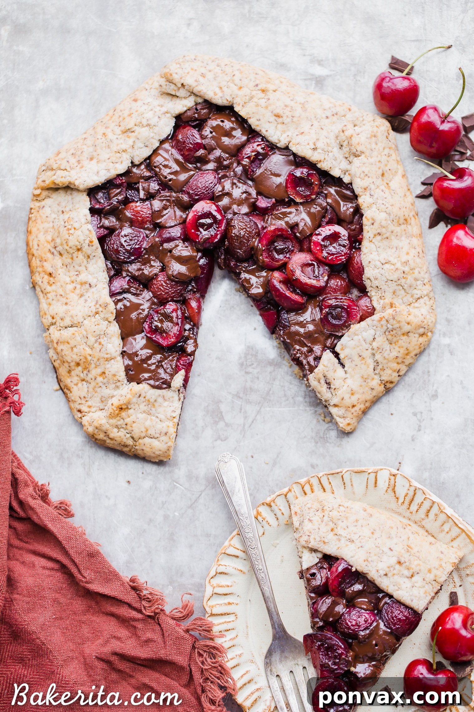 Decadent Chocolate Cherry Galette Gluten Free 3 Close-up of the Chocolate Cherry Galette, showcasing the vibrant red cherries and melted dark chocolate peeking through the golden, crimped crust.