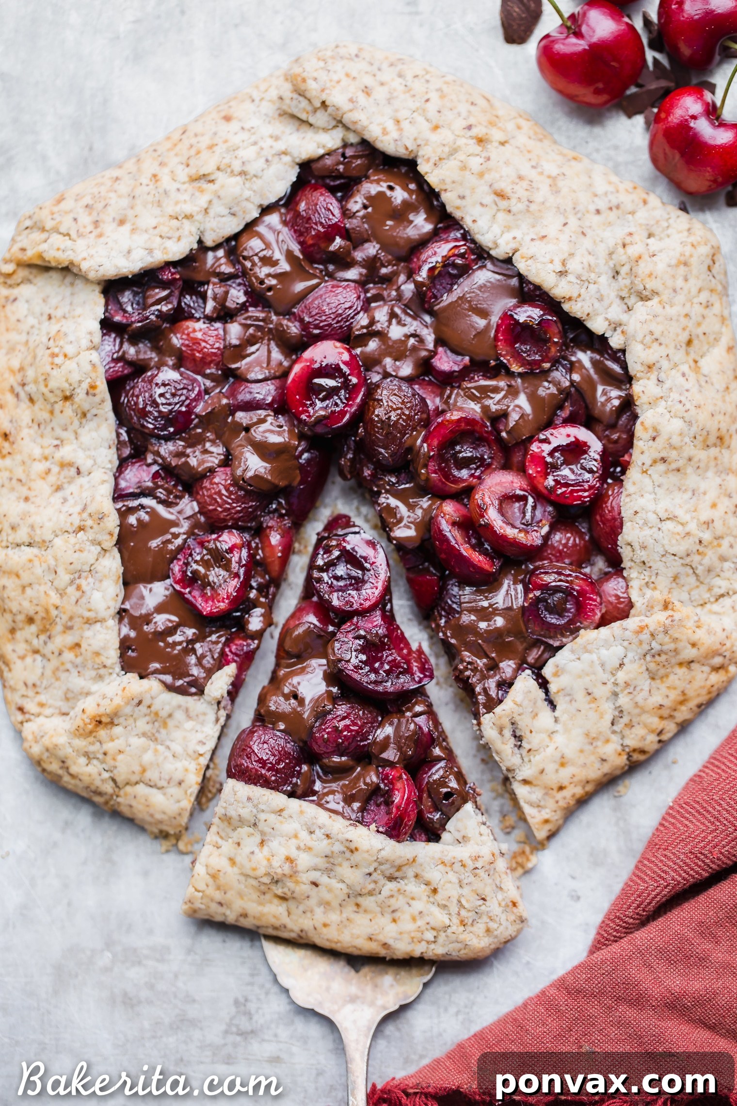 Decadent Chocolate Cherry Galette Gluten Free 6 A slice of Chocolate Cherry Galette on a plate, showing the layers of crust, chocolate, and cherries.