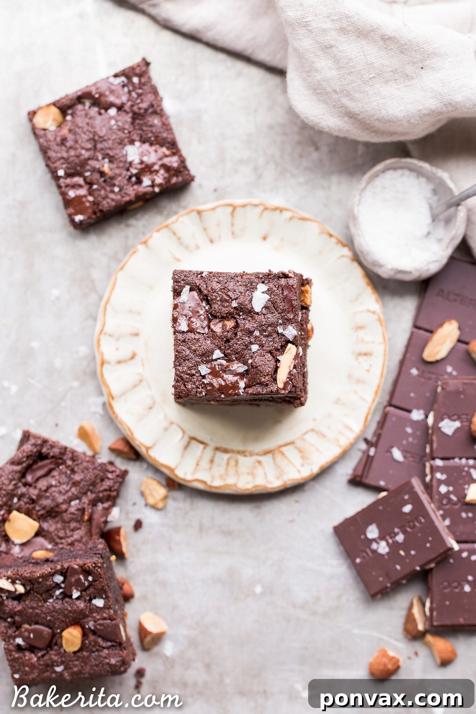 Super fudgy Salted Almond Brownies that are gluten-free, paleo, and vegan, yet taste like traditional brownies. Incredibly chocolatey with toasted almonds and sea salt for enhanced flavor and texture.