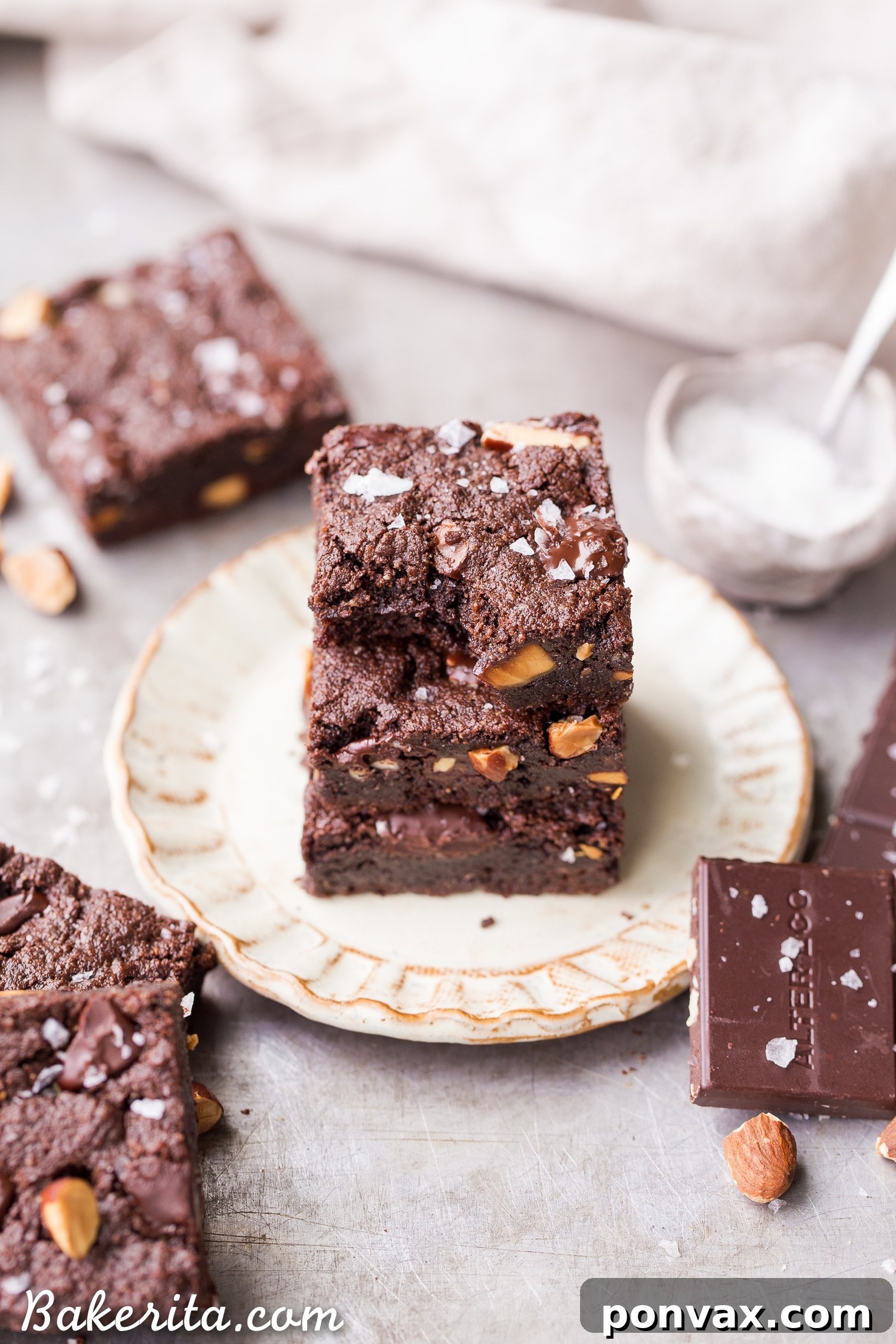 Gluten-free, paleo, and vegan Salted Almond Brownies, boasting a super fudgy and chocolatey profile. Toasted almonds and sea salt add incredible depth and texture, mirroring traditional brownie quality.