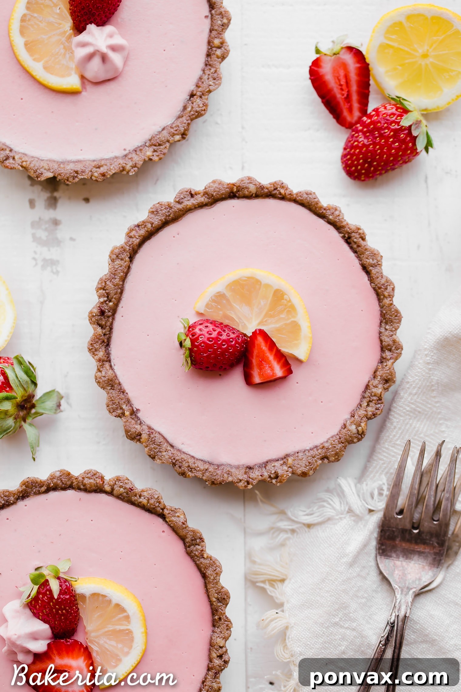 Individually portioned No Bake Strawberry Lemonade Tarts, ready to be served. A healthy and delicious option for summer gatherings.