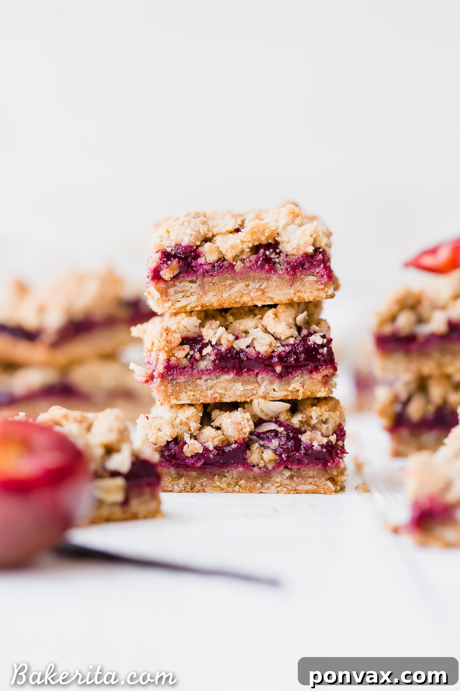These wholesome Plum Crumble Bars feature a delightful gluten-free oatmeal crust and a sweet, spiced plum jam filling, finished with a crunchy crumble topping. A perfect vegan dessert to highlight summer plums.