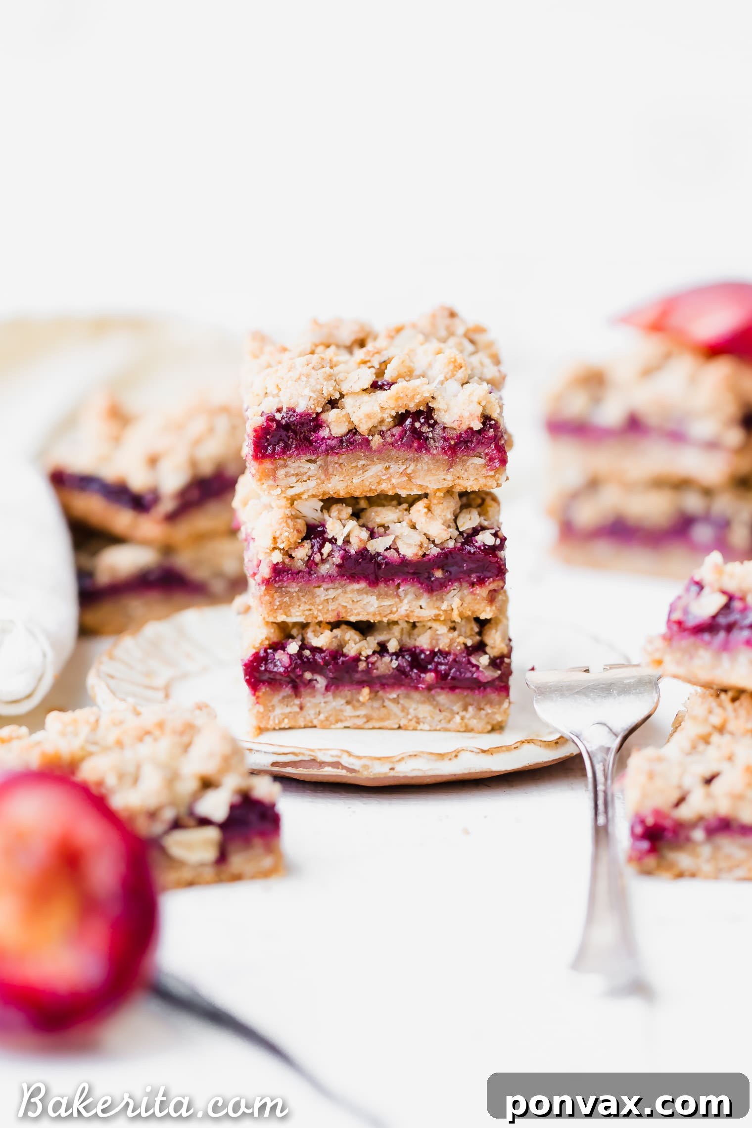 A vibrant close-up of the spiced plum jam filling, ready to be spread over the crust. This homemade jam is the star of these gluten-free and vegan crumble bars.