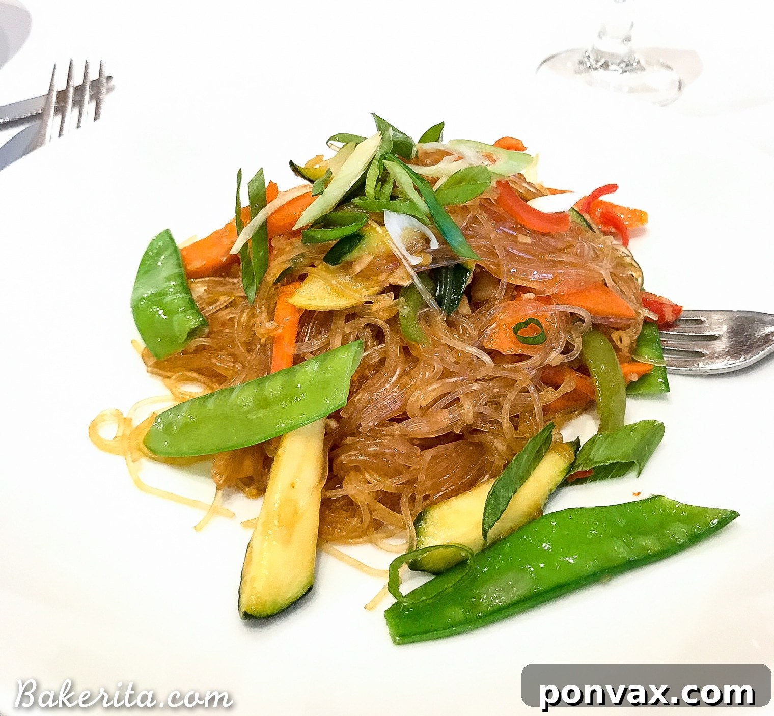Vegan Asian dinner with stir-fried vegetables and rice noodles on a cruise