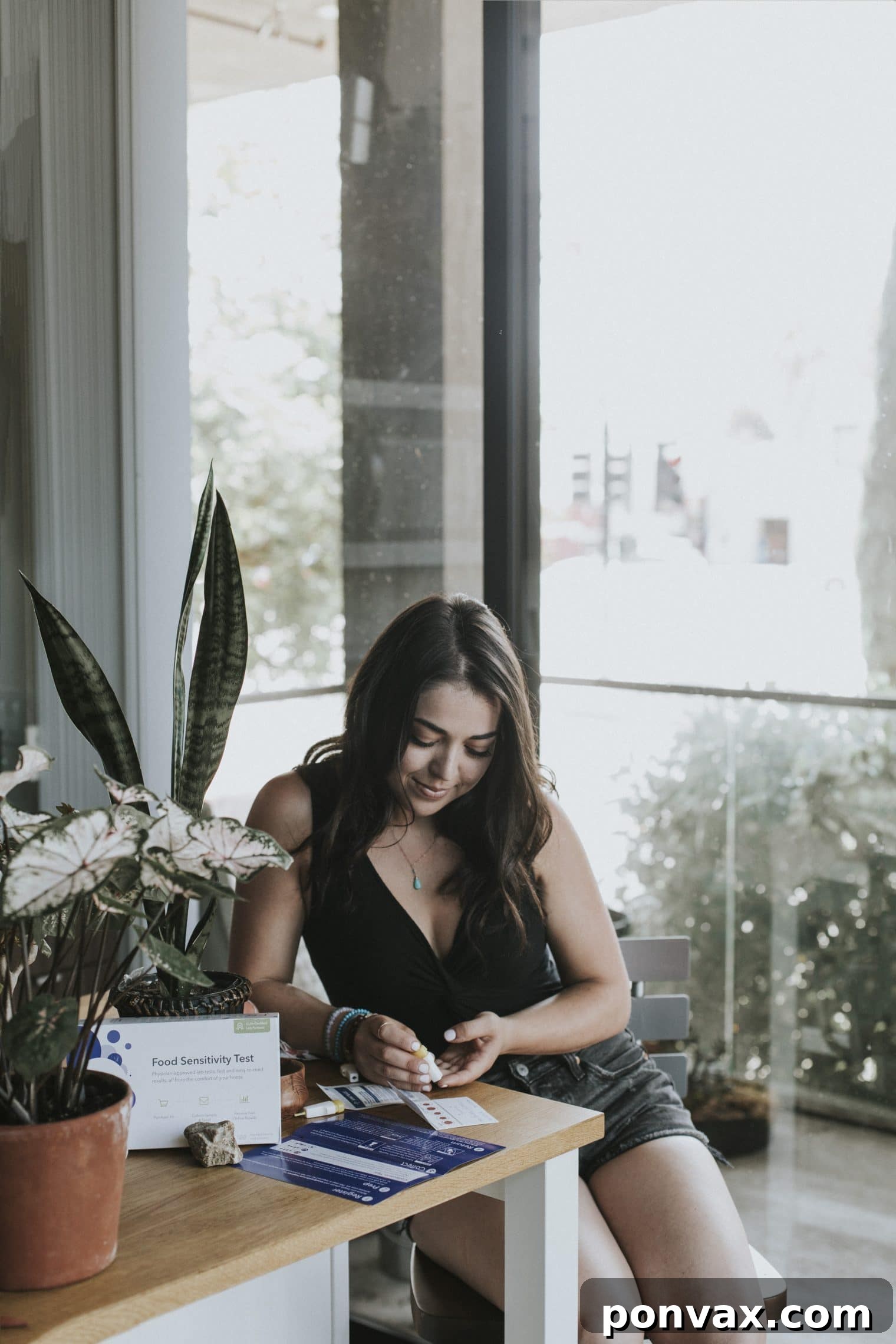 Blood sample collection process for the EverlyWell Food Sensitivity Test, showing drops on the collection card