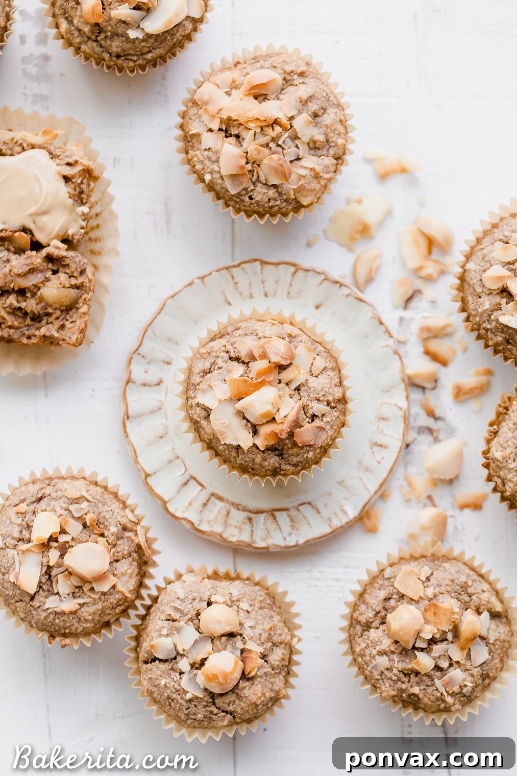 Wholesome Macadamia Nut Coconut Banana Muffins Vegan Gluten Free 7 A single Macadamia Nut Coconut Banana Muffin sits on a small white plate, ready to be enjoyed. Its golden-brown exterior and inviting aroma suggest a truly delightful homemade treat.