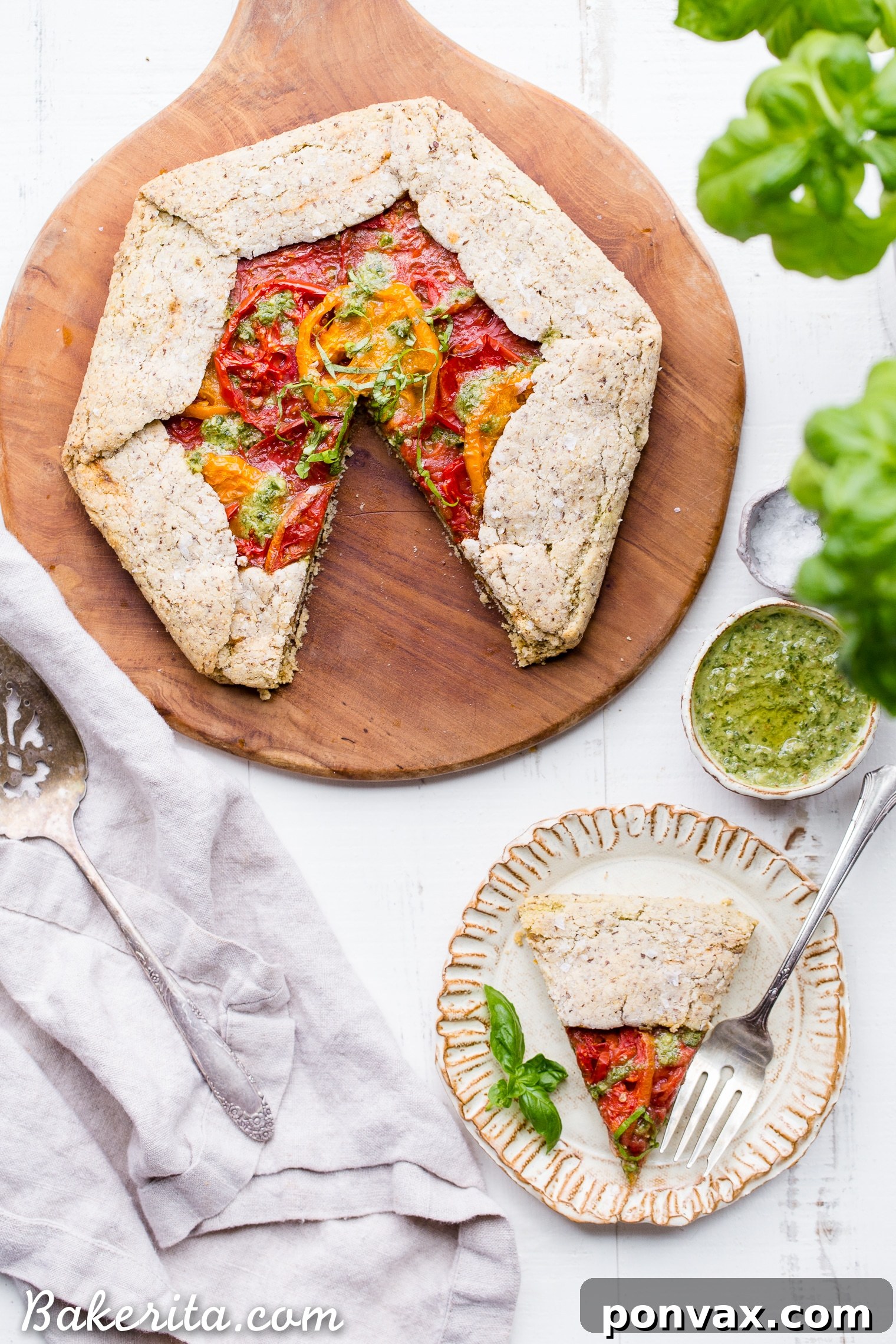Rustic Gluten-Free Pesto Tomato Galette 2 This Pesto + Heirloom Tomato Galette has an incredibly flaky, savory crust filled with homemade pesto and thick slices of heirloom tomatoes. Served warm, it's a truly delicious appetizer or meal that you'd never guess is gluten-free, paleo, and vegan.