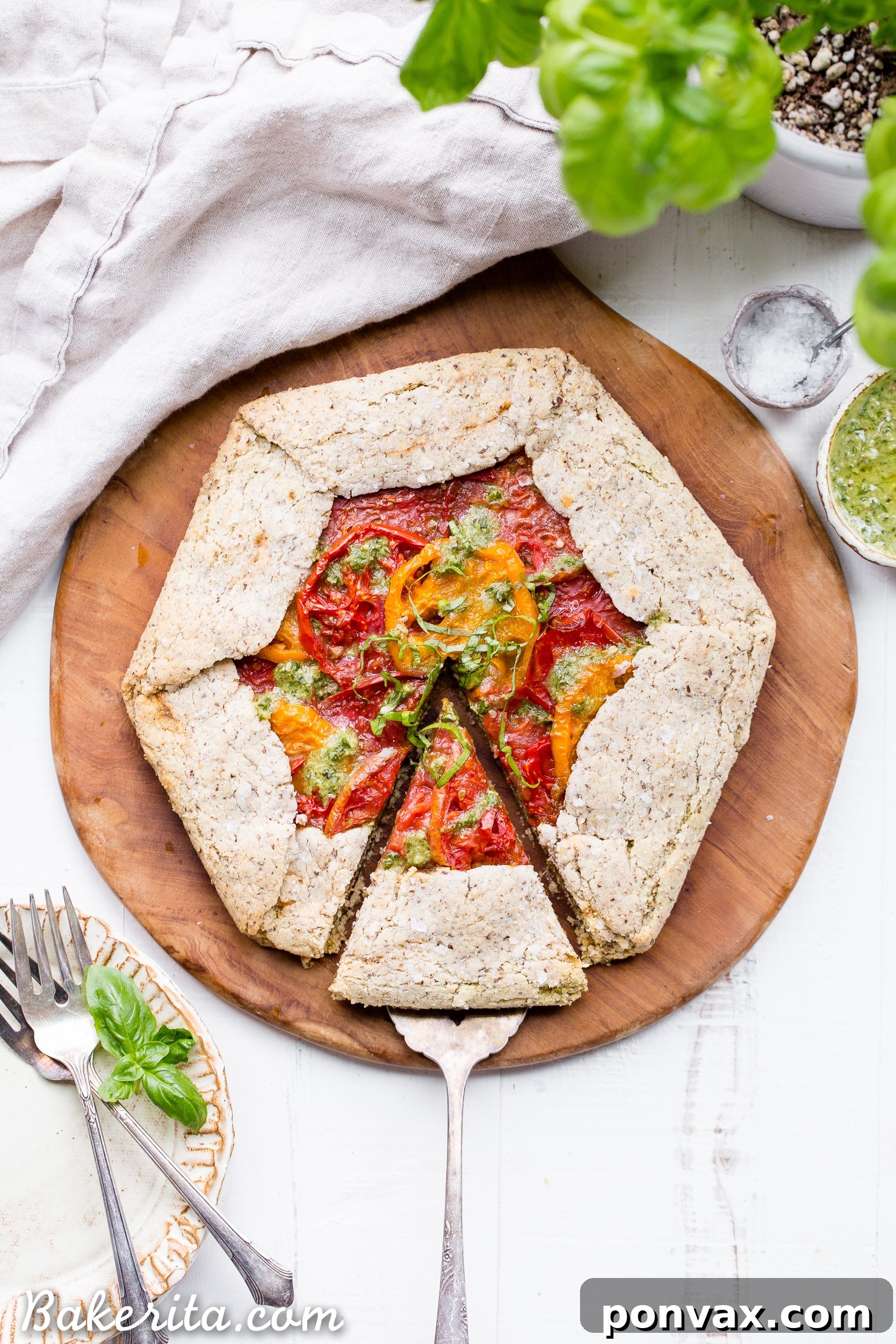 Rustic Gluten-Free Pesto Tomato Galette 3 This Pesto + Heirloom Tomato Galette has an incredibly flaky, savory crust filled with homemade pesto and thick slices of heirloom tomatoes. Served warm, it's a truly delicious appetizer or meal that you'd never guess is gluten-free, paleo, and vegan.