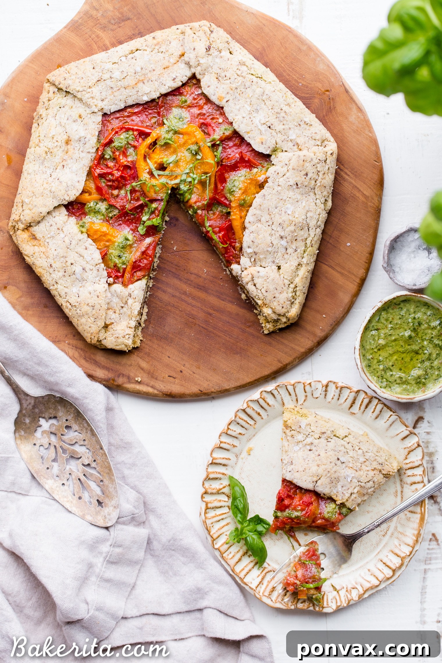 Rustic Gluten-Free Pesto Tomato Galette 5 This Pesto + Heirloom Tomato Galette has an incredibly flaky, savory crust filled with homemade pesto and thick slices of heirloom tomatoes. Served warm, it's a truly delicious appetizer or meal that you'd never guess is gluten-free, paleo, and vegan.