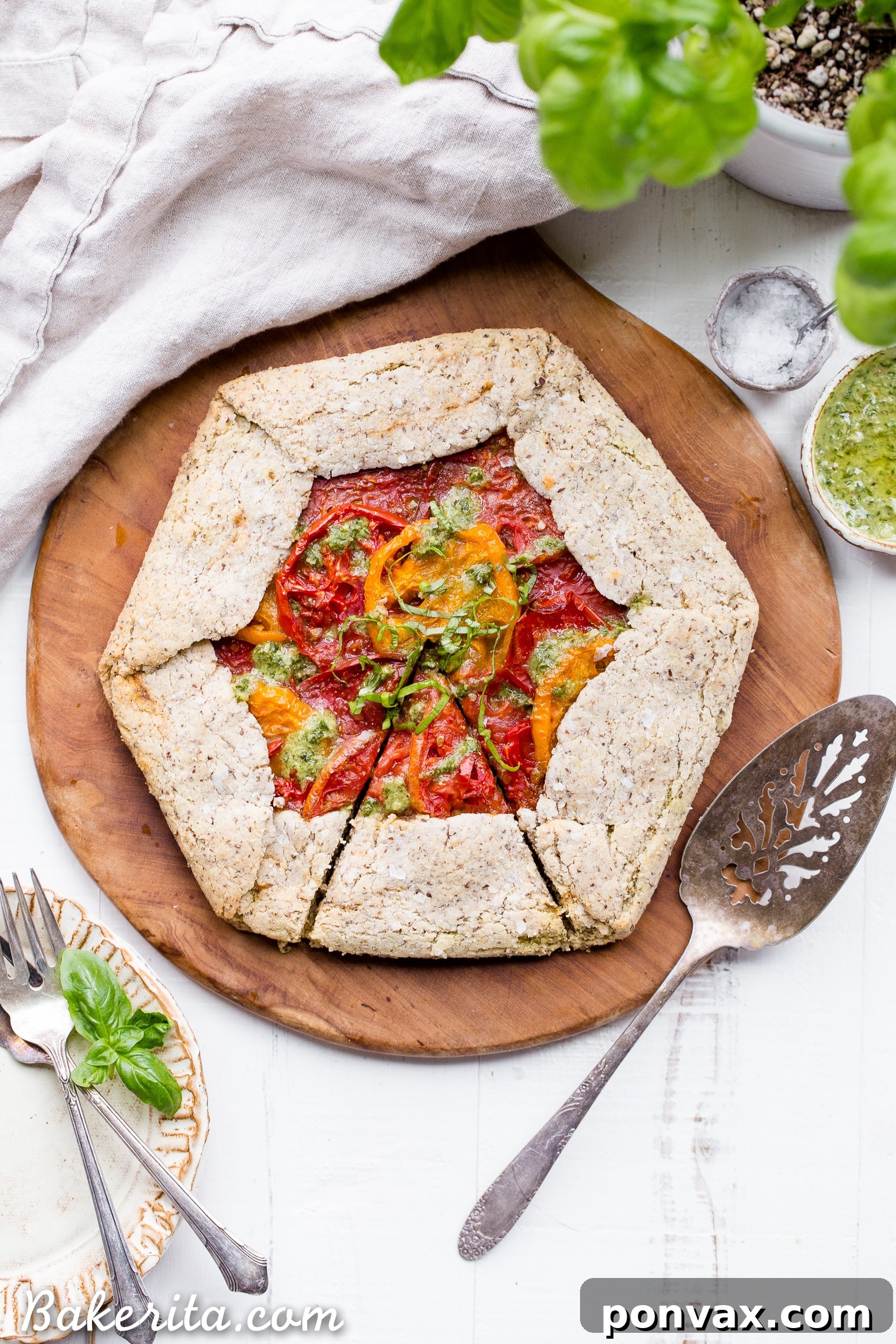 Rustic Gluten-Free Pesto Tomato Galette 6 This Pesto + Heirloom Tomato Galette has an incredibly flaky, savory crust filled with homemade pesto and thick slices of heirloom tomatoes. Served warm, it's a truly delicious appetizer or meal that you'd never guess is gluten-free, paleo, and vegan.