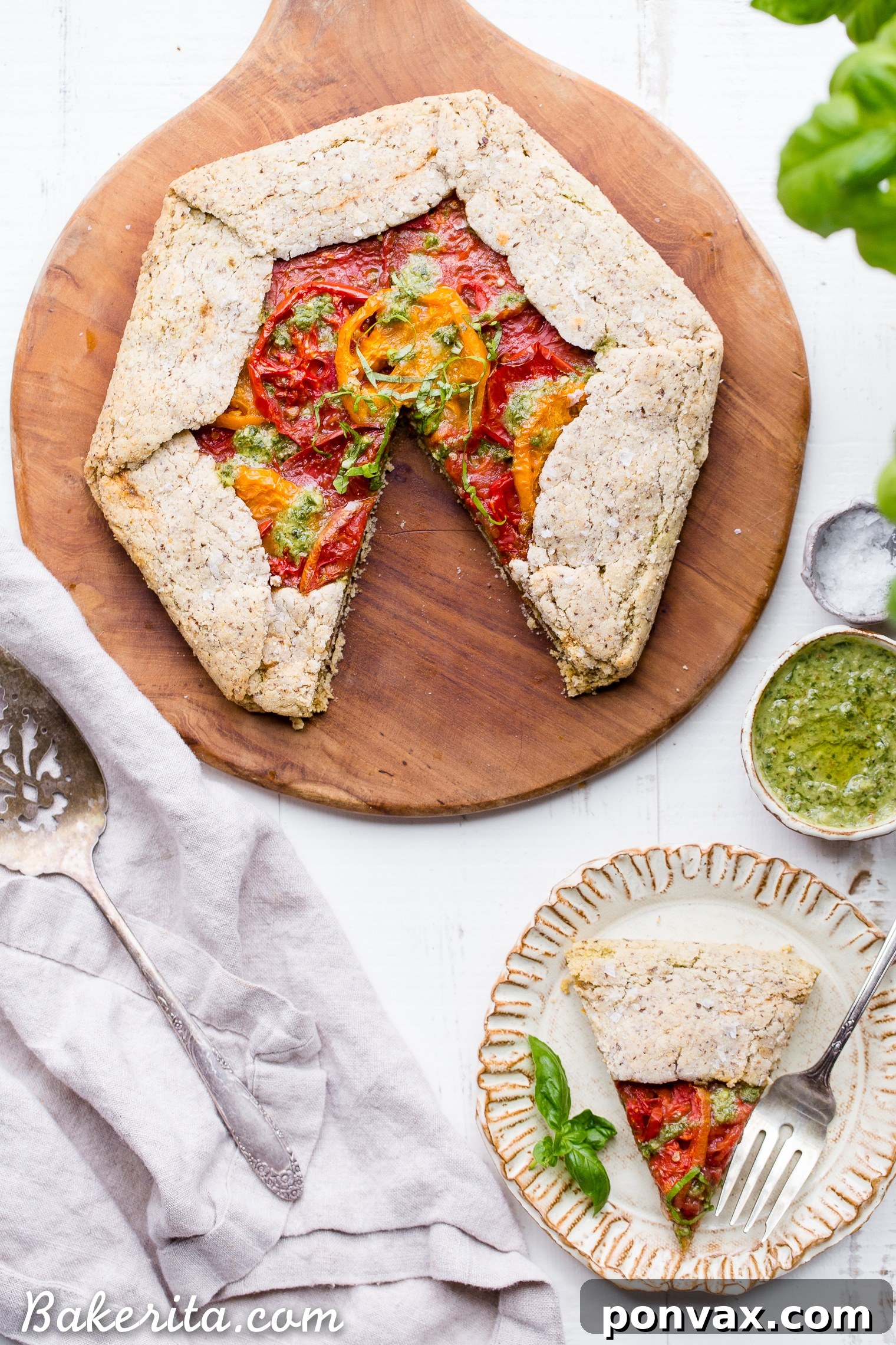 Rustic Gluten-Free Pesto Tomato Galette 7 This Pesto + Heirloom Tomato Galette has an incredibly flaky, savory crust filled with homemade pesto and thick slices of heirloom tomatoes. Served warm, it's a truly delicious appetizer or meal that you'd never guess is gluten-free, paleo, and vegan.