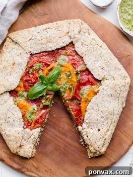 Rustic Gluten-Free Pesto Tomato Galette 8 This Pesto + Heirloom Tomato Galette has an incredibly flaky, savory crust filled with homemade pesto and thick slices of heirloom tomatoes. Served warm, it's a truly delicious appetizer or meal that you'd never guess is gluten-free, paleo, and vegan.