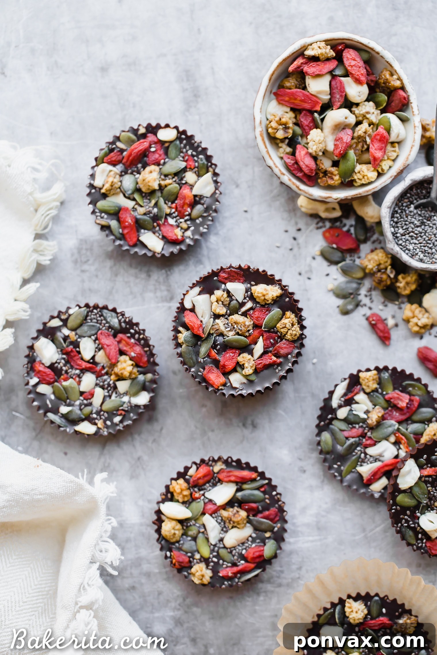 Creamy Superfood Cacao Fudge Bites topped with cashews, goji berries, and chia seeds. Gluten-free, paleo, and vegan for a healthy indulgence.