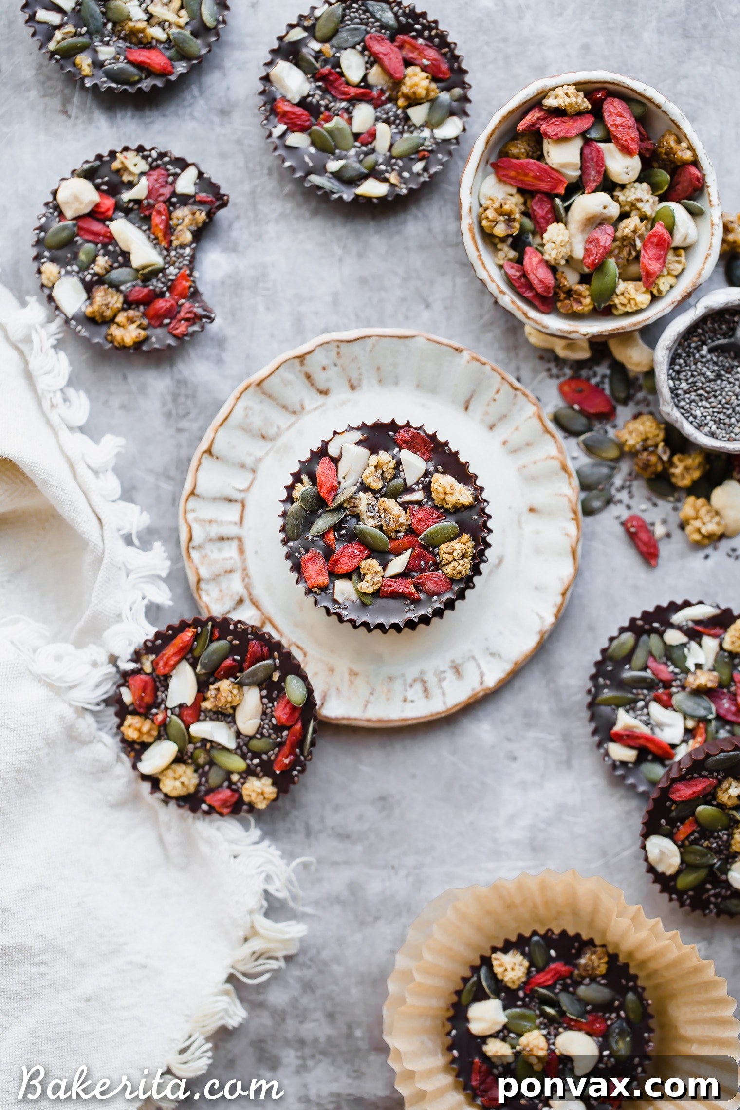 Close-up of Superfood Cacao Fudge Bites showcasing rich cacao and vibrant toppings like goji berries and cashews. A healthy, plant-based dessert option.