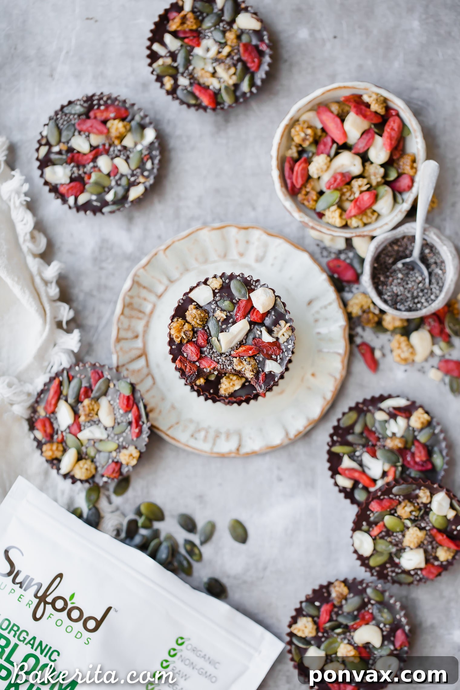 Six Superfood Cacao Fudge Bites showcasing different toppings in a close-up, emphasizing the quality of ingredients and delicious presentation. Vegan and paleo-friendly.