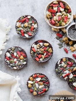 These Superfood Cacao Fudge Bites are creamy, so rich in cacao flavor, and topped with all sorts of delicious superfoods, like cashews, goji berries, chia seeds, and more. They'll satisfy your candy craving and they're gluten-free, paleo, and vegan!
