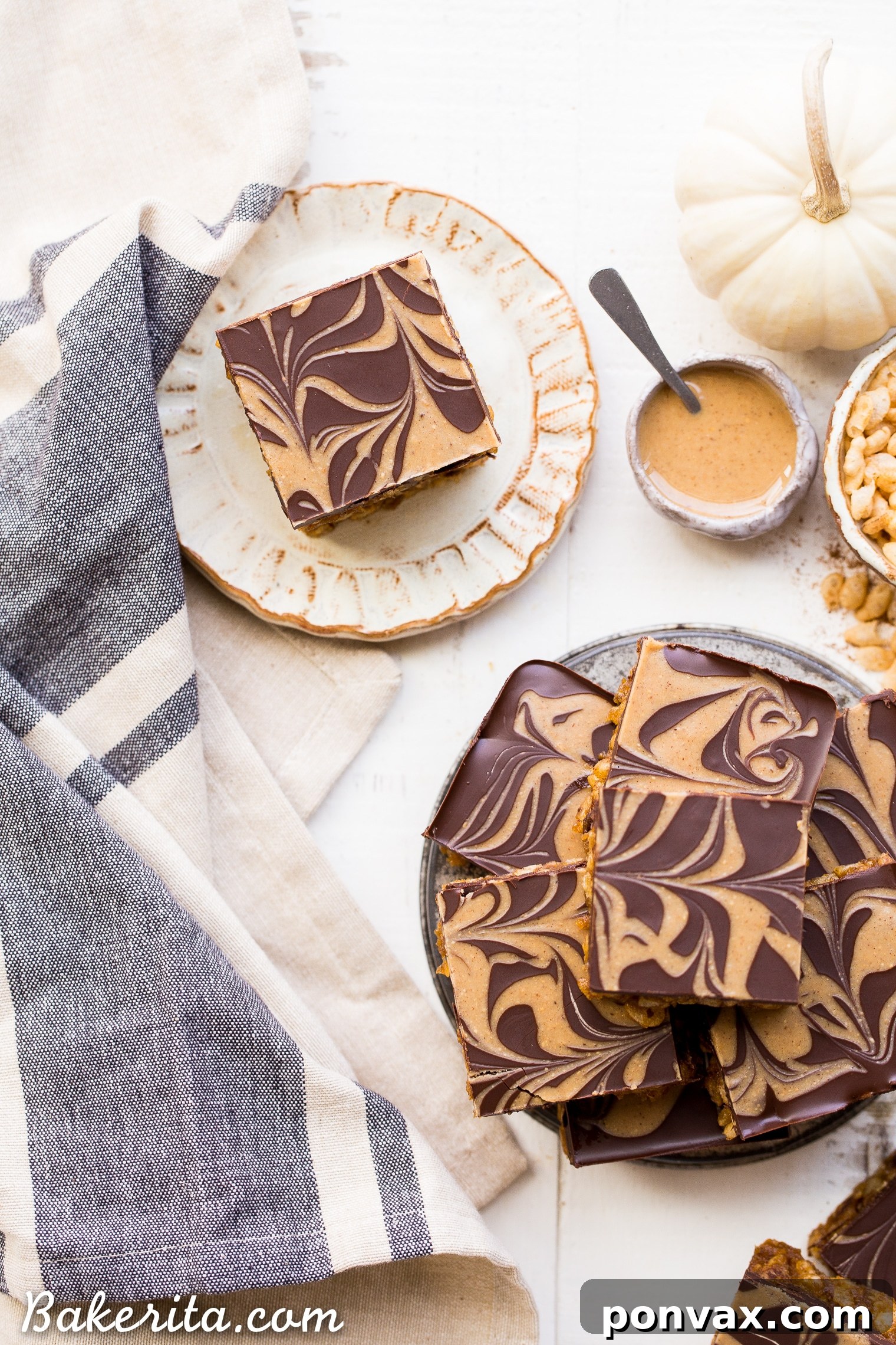 These Chocolate Pumpkin Spice Crispy Bars have a pumpkin spice rice crispy base, topped with a layer of dark chocolate and a pumpkin spice swirl. These bars are easy to make, beautiful, delicious, and gluten-free + vegan!