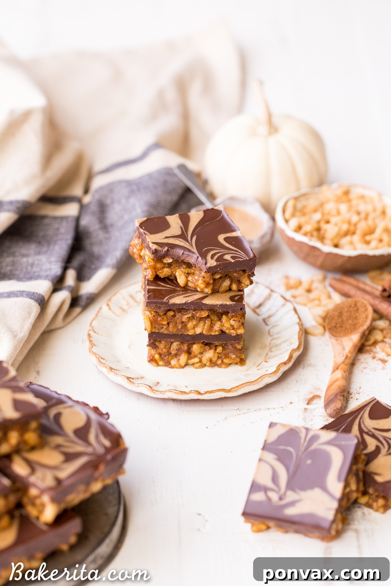 These Chocolate Pumpkin Spice Crispy Bars have a pumpkin spice rice crispy base, topped with a layer of dark chocolate and a pumpkin spice swirl. These bars are easy to make, beautiful, delicious, and gluten-free + vegan!