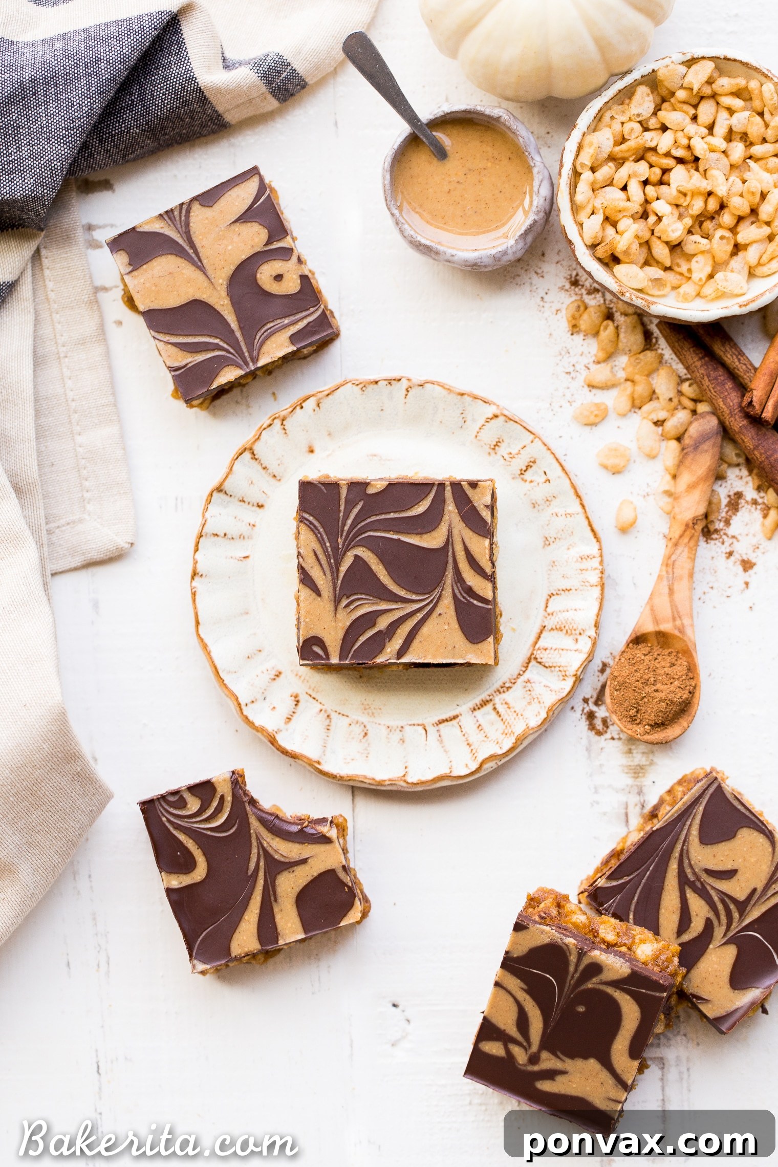 These Chocolate Pumpkin Spice Crispy Bars have a pumpkin spice rice crispy base, topped with a layer of dark chocolate and a pumpkin spice swirl. These bars are easy to make, beautiful, delicious, and gluten-free + vegan!