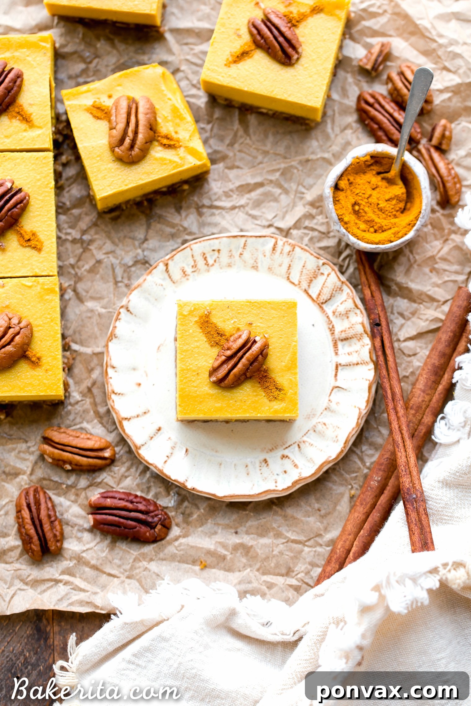 These No Bake Golden Milk Cheesecake Bars are a dessert that's loaded with the anti-inflammatory benefits of turmeric and the warmth and comfort of golden milk. They're deliciously spiced, gluten-free, paleo, vegan, and perfect for sharing.
