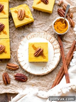 These No Bake Golden Milk Cheesecake Bars are a dessert that's loaded with the anti-inflammatory benefits of turmeric and the warmth and comfort of golden milk. They're deliciously spiced, gluten-free, paleo, vegan, and perfect for sharing.