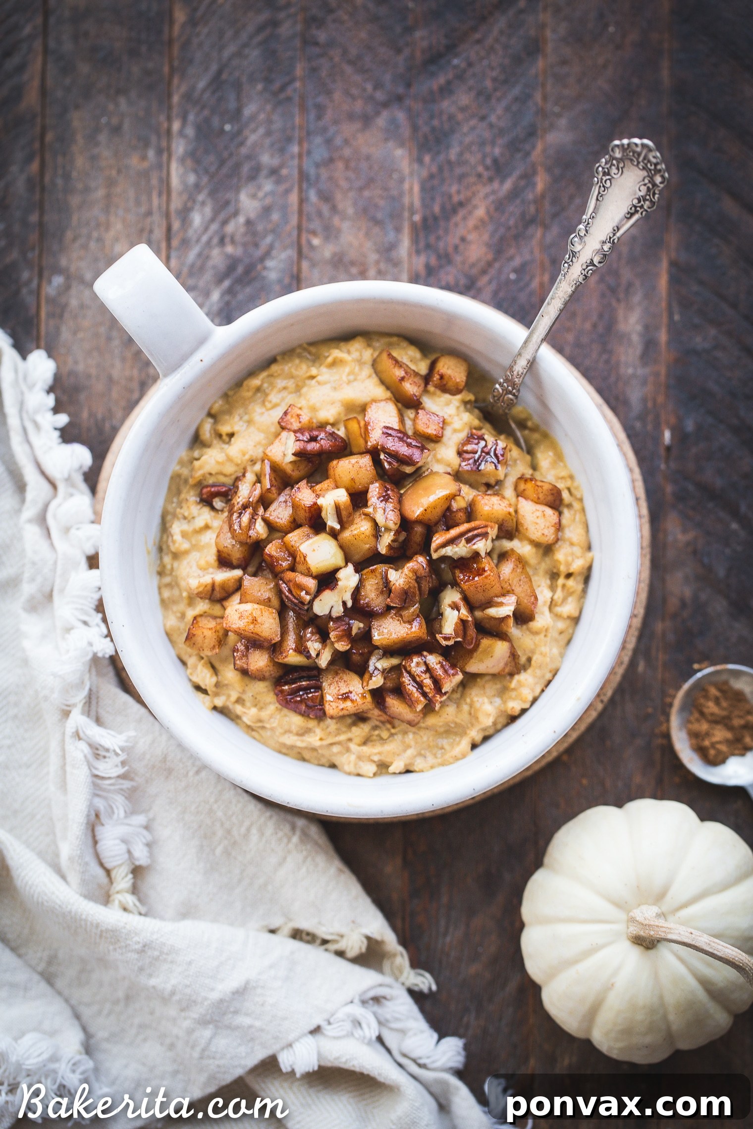 Warm Spiced Pumpkin Oats and Golden Caramel Apples 4 A vibrant bowl of Pumpkin Spice Oatmeal, topped with caramelized sauteed apples and a sprinkle of spices, showcasing its rich, creamy texture and inviting fall flavors.