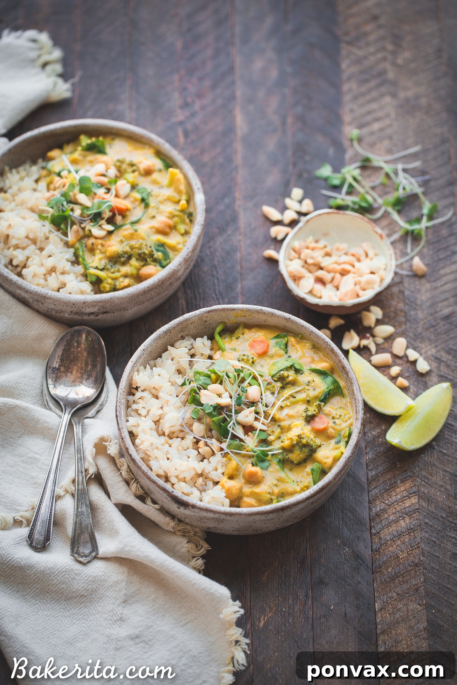 Close-up shot of the creamy Vegan Broccoli Chickpea Curry simmering in a large pot, showcasing the vibrant green broccoli florets and golden chickpeas in a rich, amber-hued sauce. Steam gently rises, hinting at its fresh aromas.