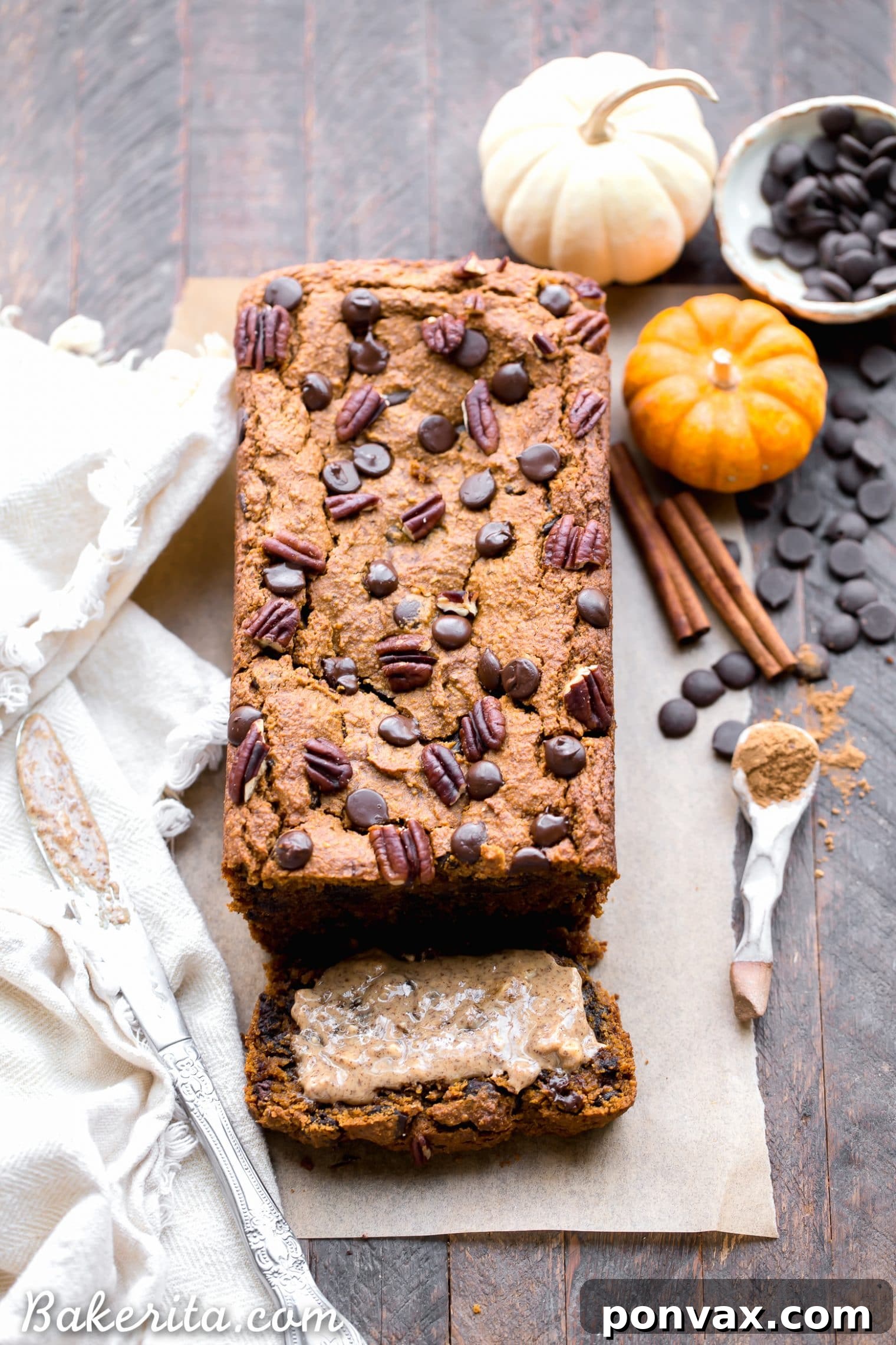 Slices of Chocolate Chip Vegan Pumpkin Bread neatly arranged on a plate, showing off the fluffy texture and distribution of chocolate chips, an excellent plant-based snack.